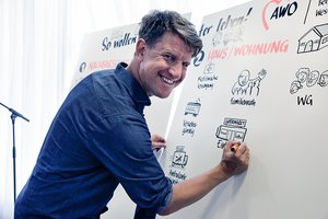 Man writing on a flipchart