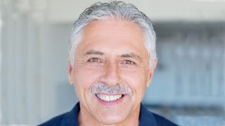 Harald Schmid: Ein Mann mit grauen Haaren und Schnauzbart.